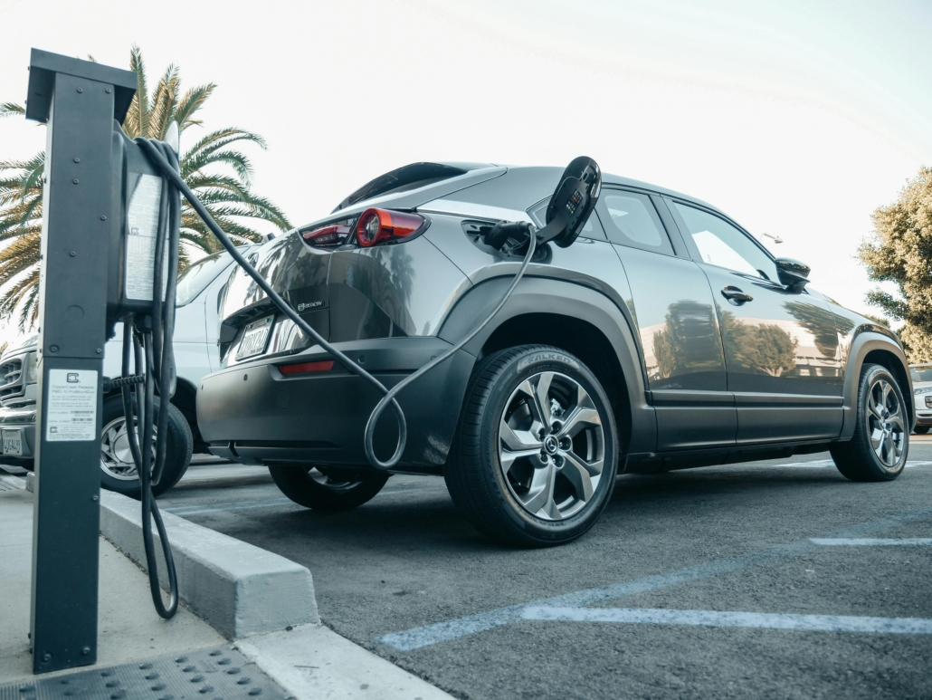 an EV charger is providing power to an EV